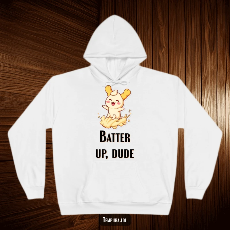 Funny tempura character joyfully riding a playful wave of batter on a cozy hoodie, perfect for warm, humorous moments.