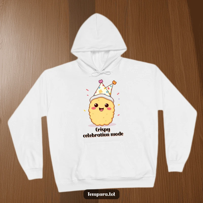 Funny tempura character in a party hat with confetti, looking cheerful on a soft hoodie, great for cozy, fun wear.