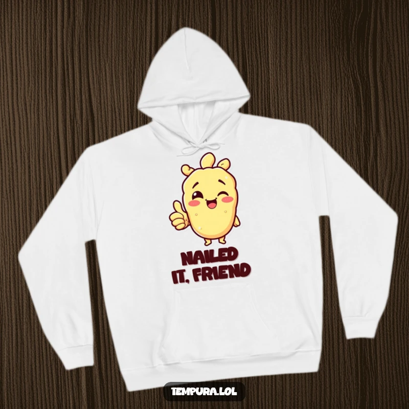 Funny tempura character winking and giving a thumbs up on a soft hoodie, offering comfort and positive reinforcement.