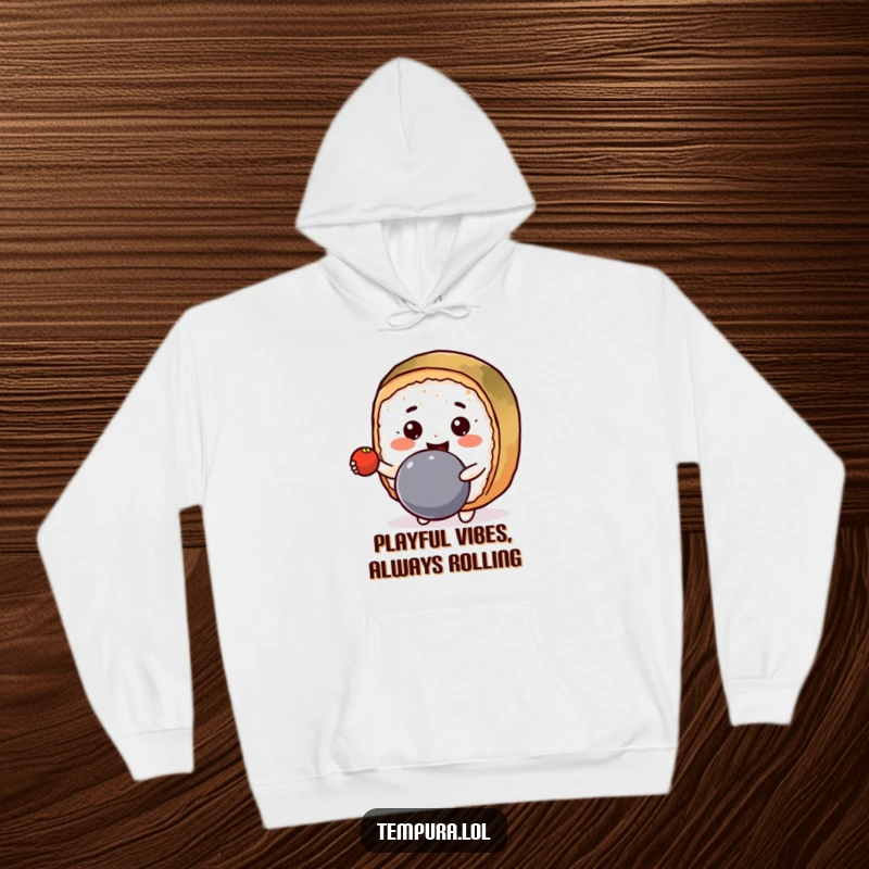 Funny Hoodie showcasing a smiling Kawaii sushi roll happily bouncing a ball, perfect for cozy days.